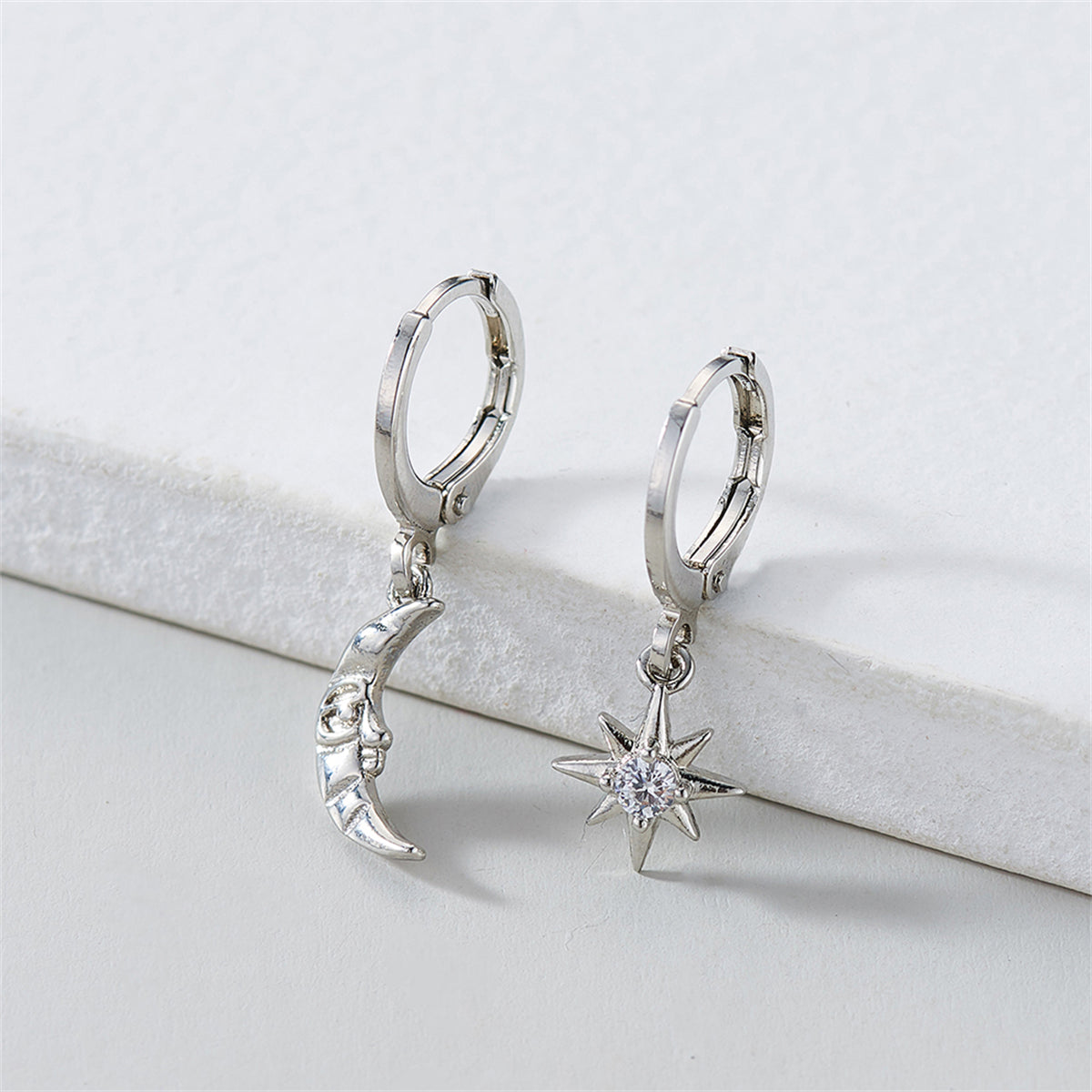 Cubic Zirconia and Silver-Plated Sun and Moon Asymmetrical Huggie Earrings, silver huggie earrings, detail close-up