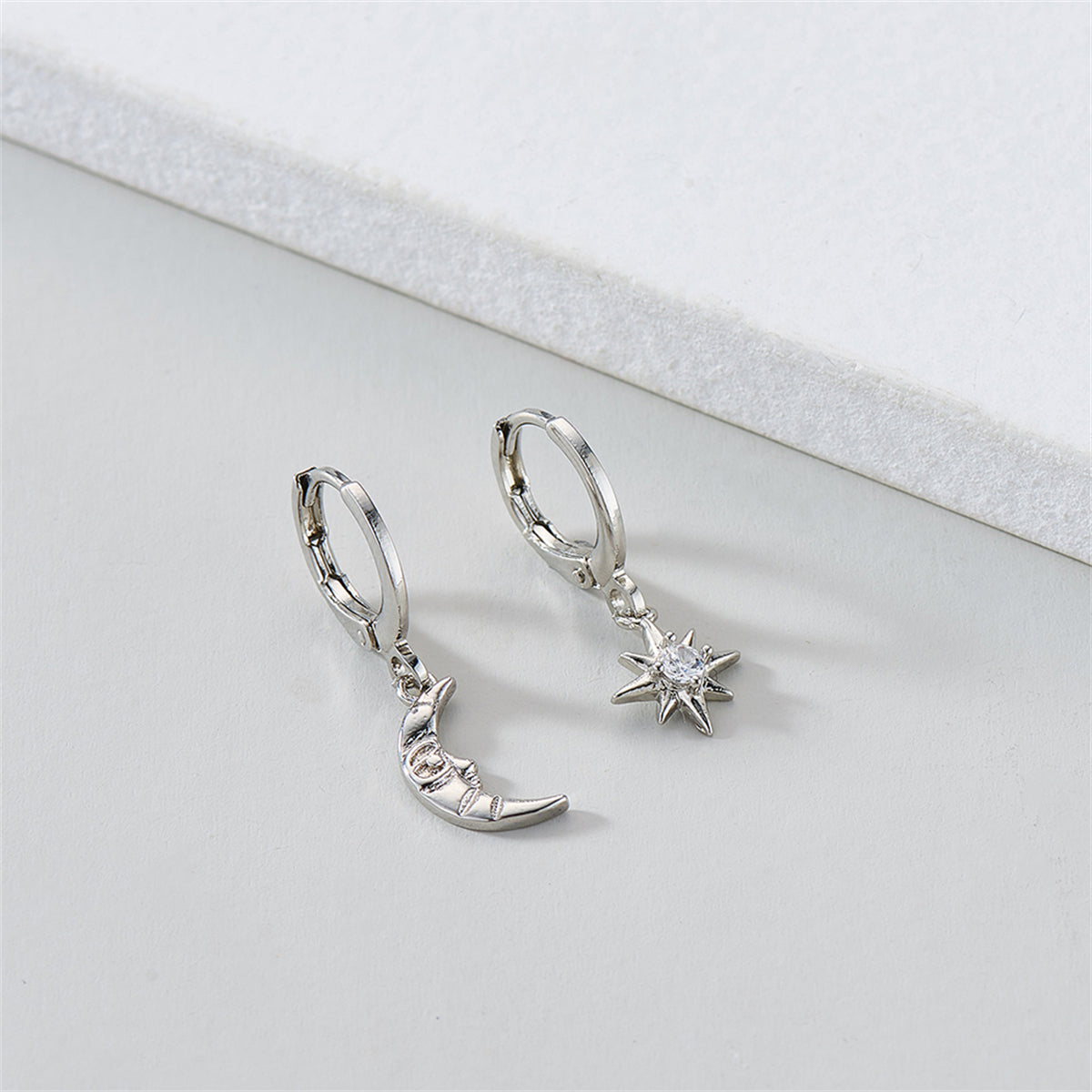 Cubic Zirconia and Silver-Plated Sun and Moon Asymmetrical Huggie Earrings, silver huggie earrings, lifestyle look