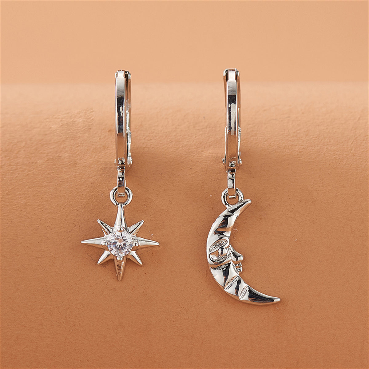 Cubic Zirconia and Silver-Plated Sun and Moon Asymmetrical Huggie Earrings, silver huggie earrings, front view