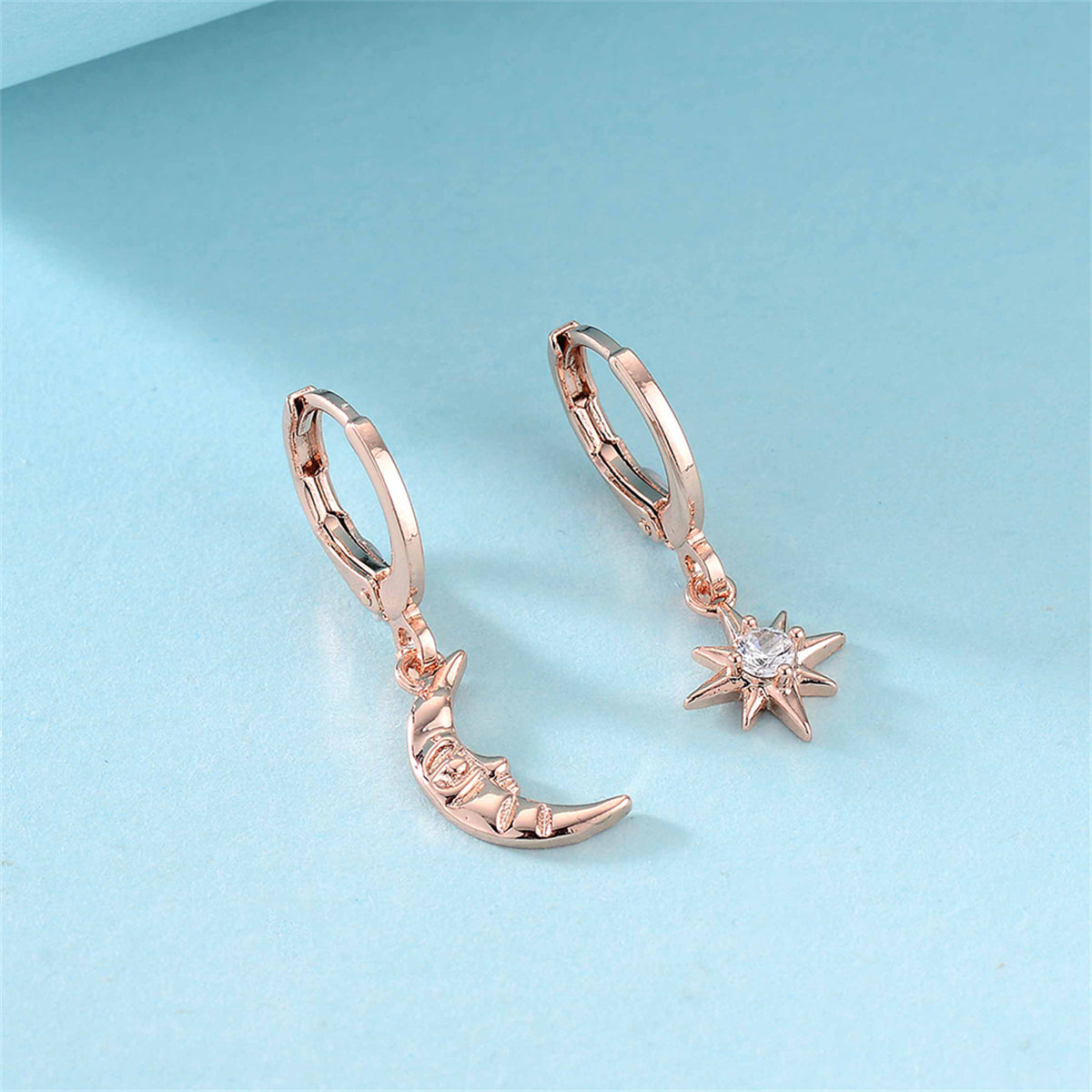 Cubic Zirconia and 18K Rose Gold-Plated Sun Moon Huggie Earrings, rose gold huggie earrings, everyday style, side view