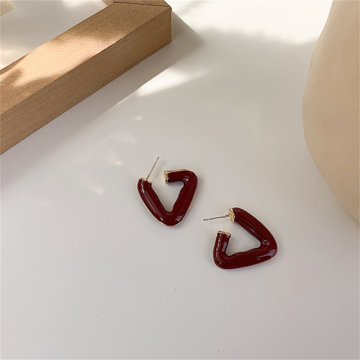 Red Enamel and 18K Gold-Plated Open Triangle Huggie Earrings, gold huggie earrings, dainty minimalist design, detail close-up