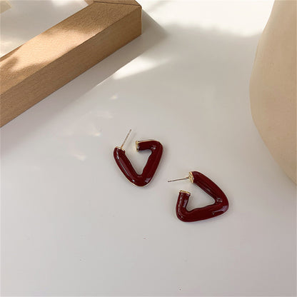 Red Enamel and 18K Gold-Plated Open Triangle Huggie Earrings, gold huggie earrings, dainty minimalist design, detail close-up