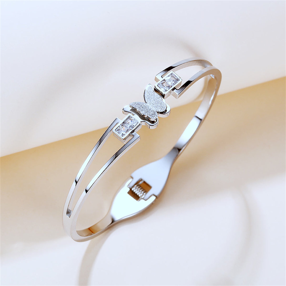 Cubic Zirconia and Silver-Plated Frosted Butterfly Layered Band Bangle, silver bangle bracelet, everyday style, side view