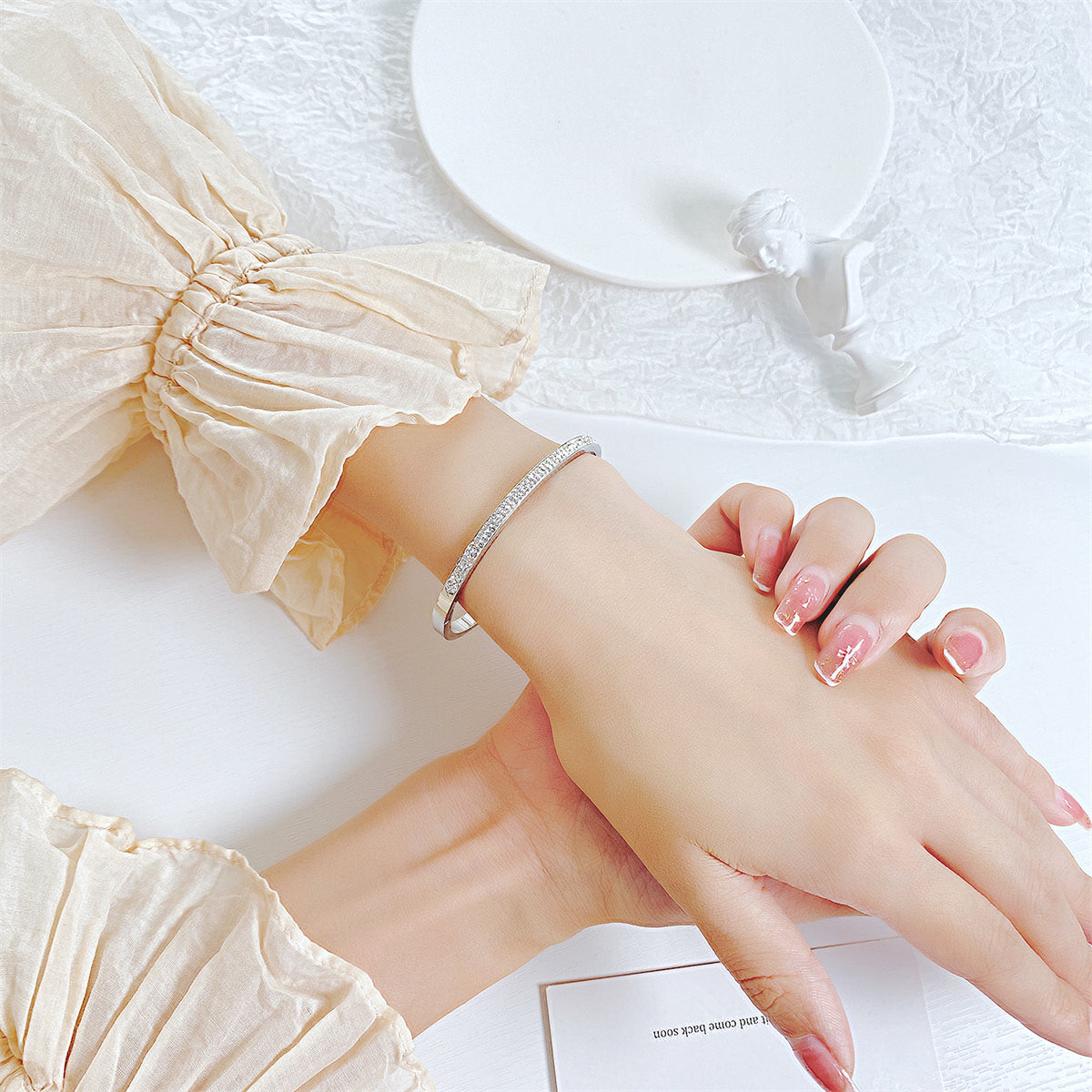 Clear Cubic Zirconia and Silver-Plated Hinged Bangle, silver bangle bracelet, vintage-inspired design, lifestyle look