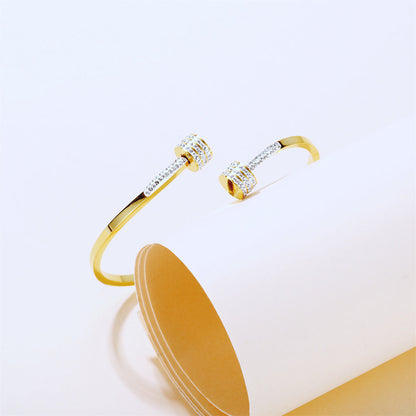 Cubic Zirconia and 18K Gold-Plated Coin Bypass Bangle, gold bangle bracelet, dainty minimalist design, side view
