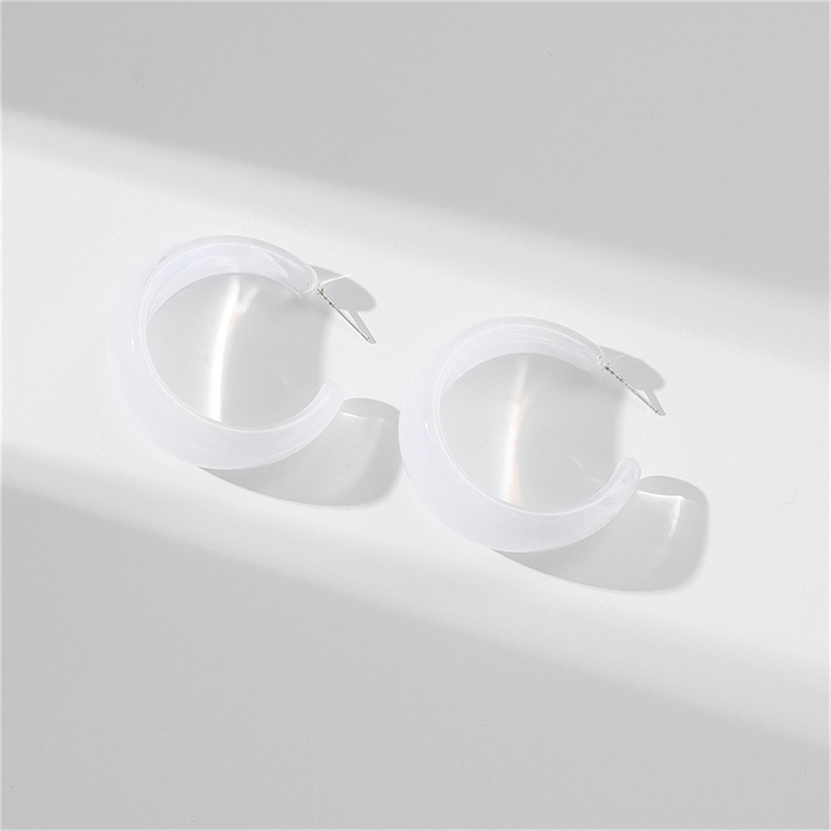 Clear Resin and Silver-Plated Open Hoop Earrings, vintage-inspired design, front view