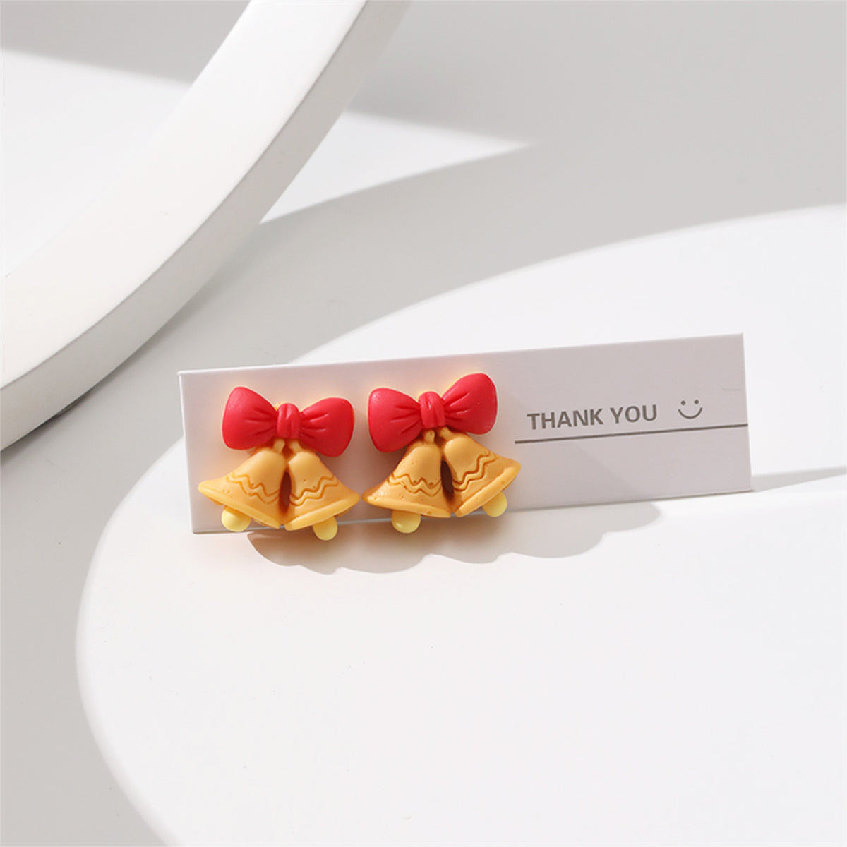 Red Resin and Silver-Plated Bow Bell Stud Earrings, silver stud earrings for women, botanical inspired, side view