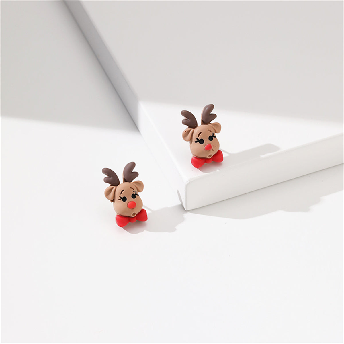 Green and Red Resin Silver-Plated Reindeer Bow Stud Earrings, silver stud earrings for women, detail close-up
