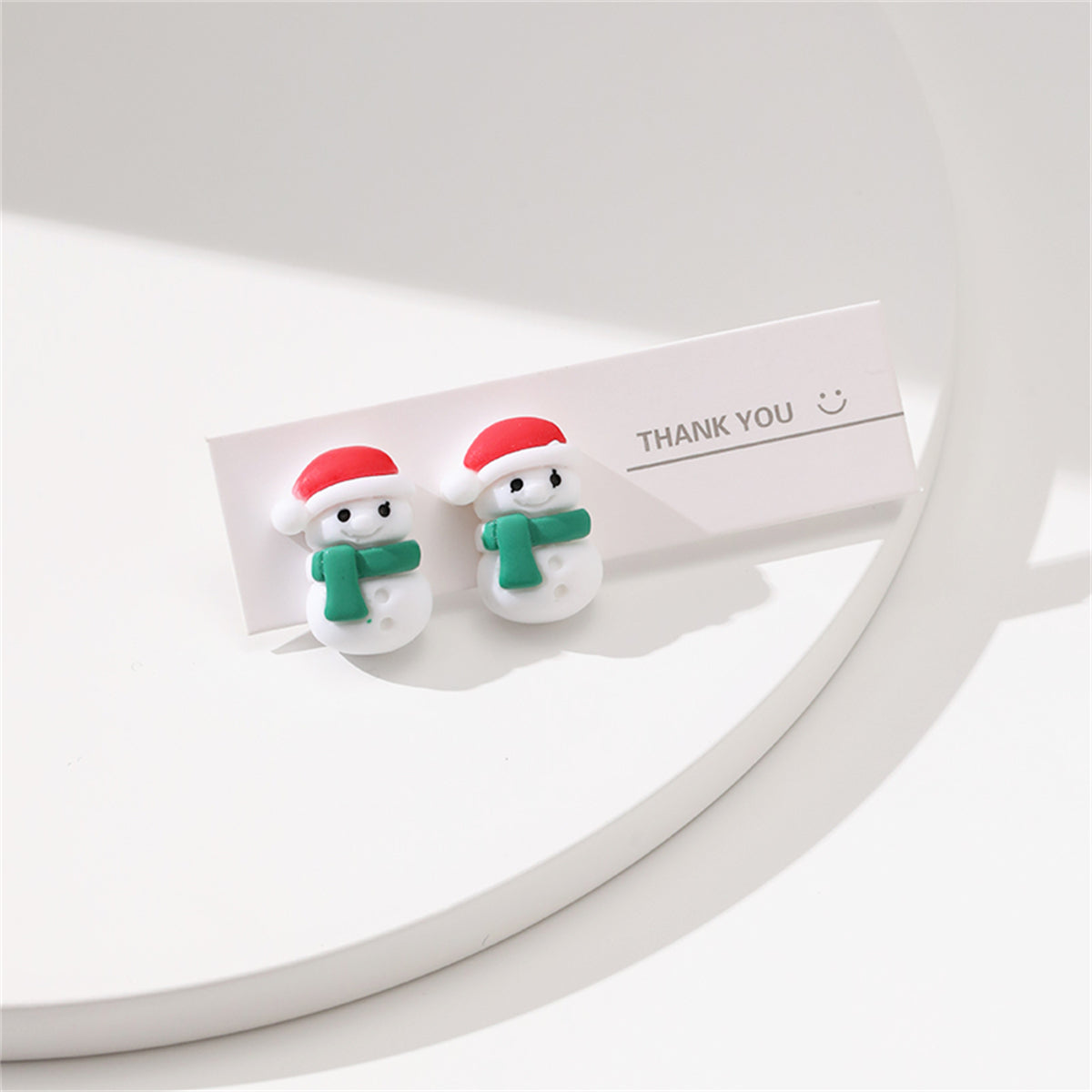 Red and Green Resin Silver-Plated Snowman Stud Earrings, silver stud earrings for women, dainty minimalist design, side view
