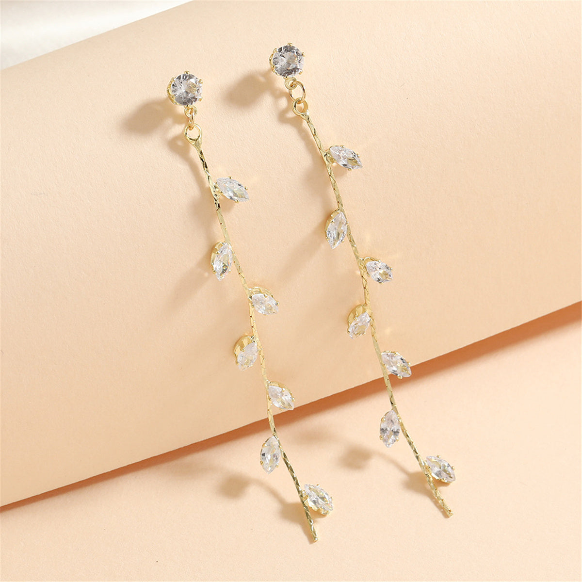 Crystal and 18K Gold-Plated Leaf Strand Drop Earrings, gold drop earrings for women, botanical inspired, detail close-up