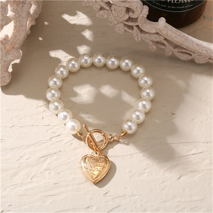 Pearl and 18K Gold-Plated Heart Charm Toggle Bracelet, gold bracelet for women, dainty minimalist design, styled look