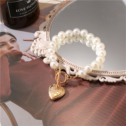 Pearl and 18K Gold-Plated Heart Charm Toggle Bracelet, gold bracelet for women, dainty minimalist design, detail close-up