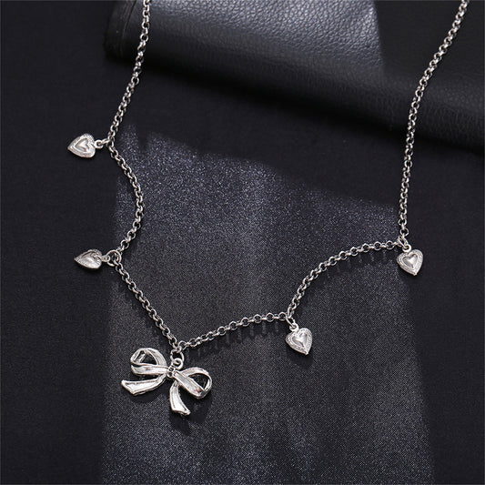 Silver-Plated Bow Heart Station Necklace, silver pendant necklace for women, dainty minimalist design, front view