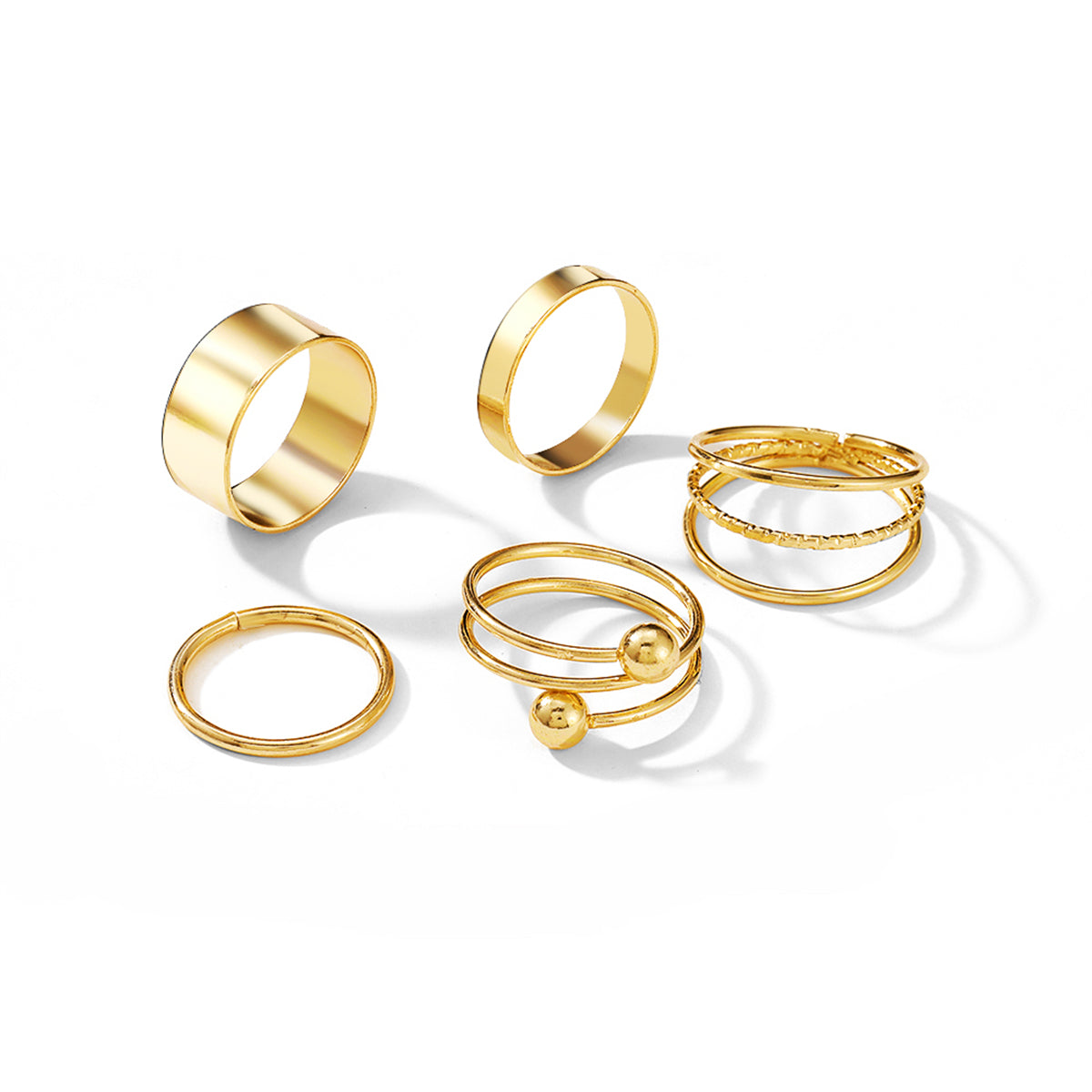 A beautiful set of three gold rings, each with a unique design, crafted in 18K gold plating for a luxurious touch.