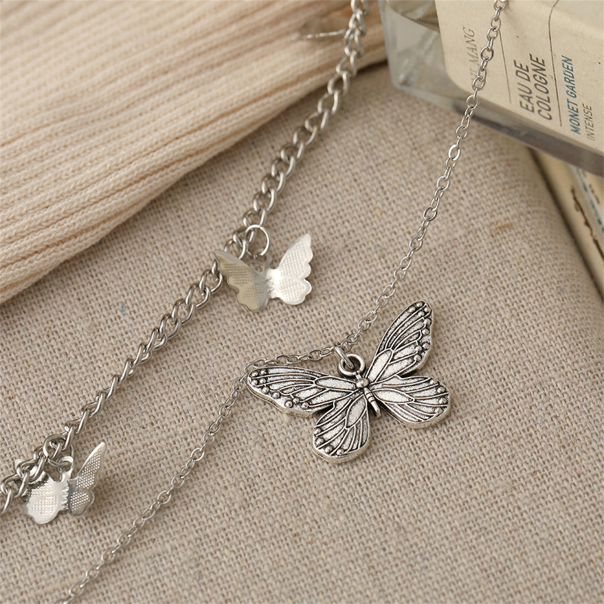 Silver-Plated Layered Butterfly Station Necklace, silver pendant necklace for women, botanical inspired, detail close-up