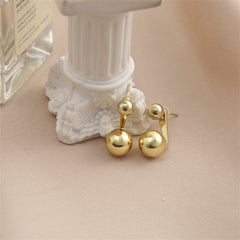 Dazzling 18K gold-plated ear jackets adorned with two exquisite balls, perfect for making a bold fashion statement.