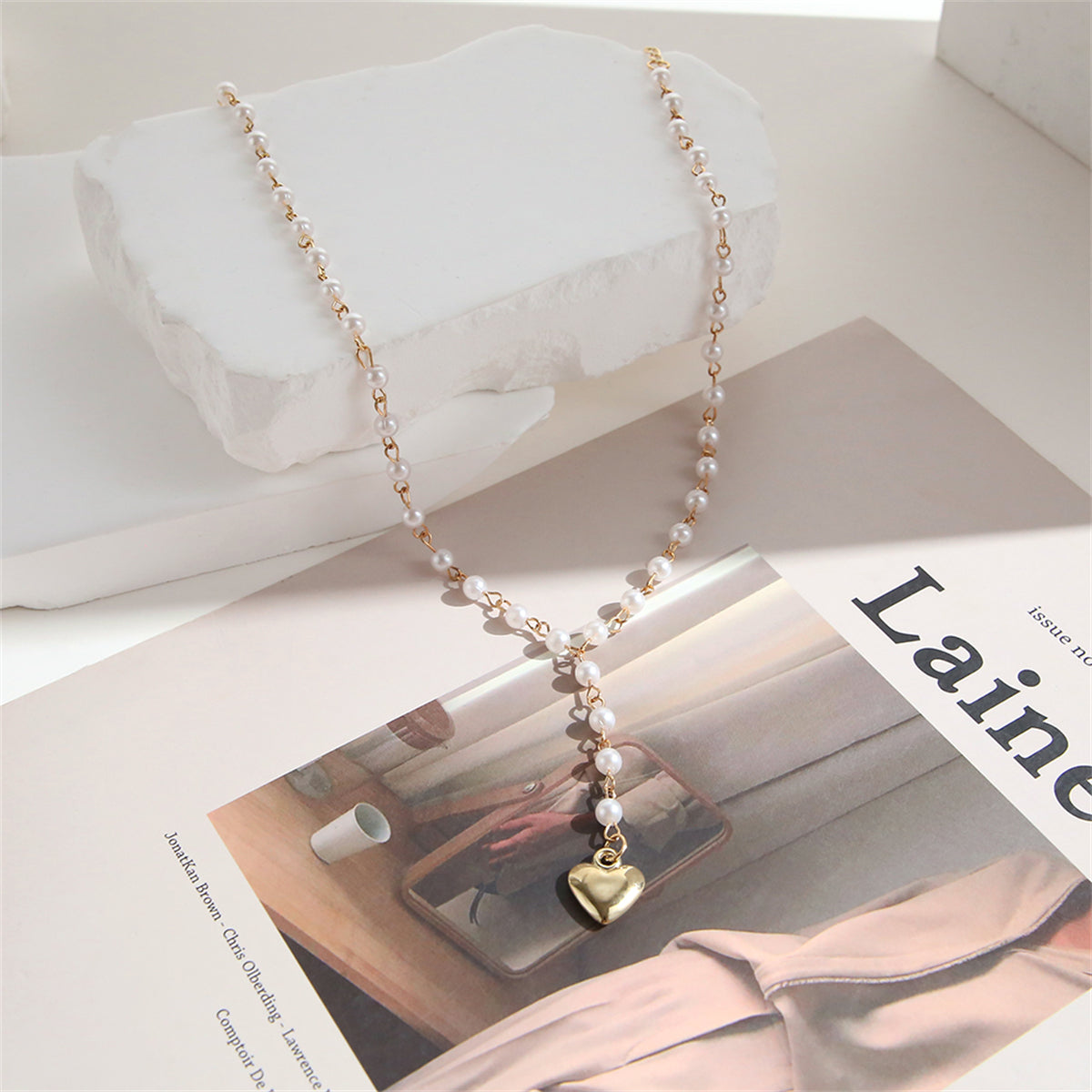 Pearl and 18K Gold-Plated Heart Station Lariat Necklace, gold pendant necklace for women, dainty minimalist design, side view
