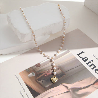 Pearl and 18K Gold-Plated Heart Station Lariat Necklace, gold pendant necklace for women, dainty minimalist design, side view