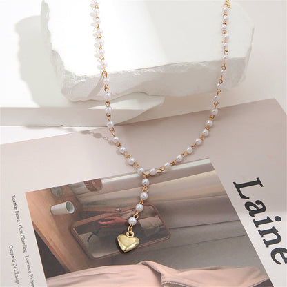 Pearl and 18K Gold-Plated Heart Station Lariat Necklace, gold pendant necklace for women, detail close-up