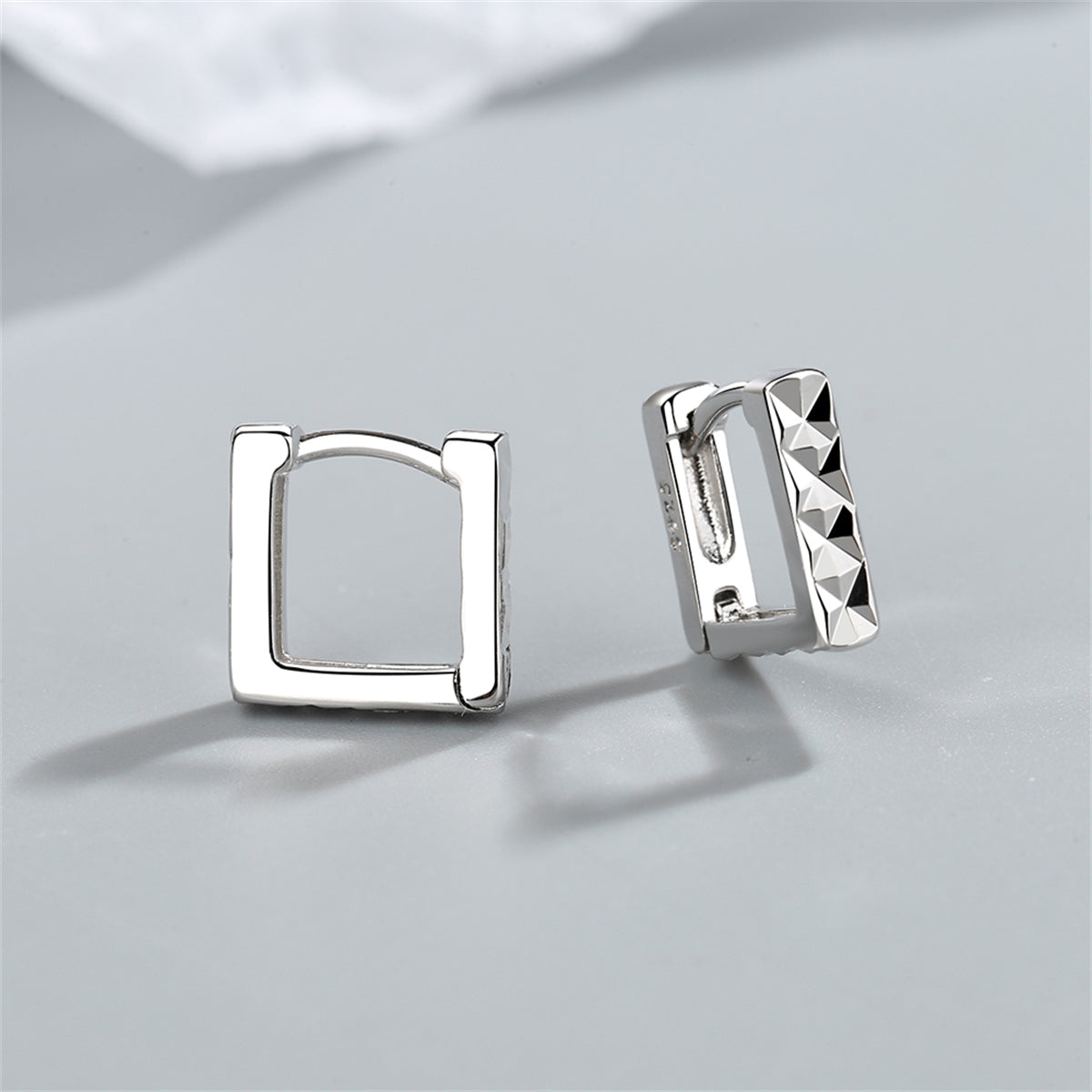 Silver-Plated Diamond-Cut Open Square Huggie Earrings, silver huggie earrings, botanical inspired, front view