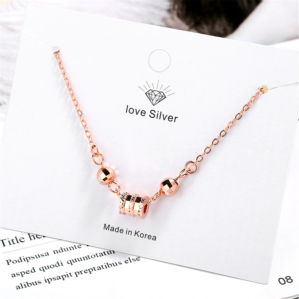 Cubic Zirconia and 18K Rose Gold-Plated Cylinder Charm Bracelet, rose gold bracelet for women, detail close-up