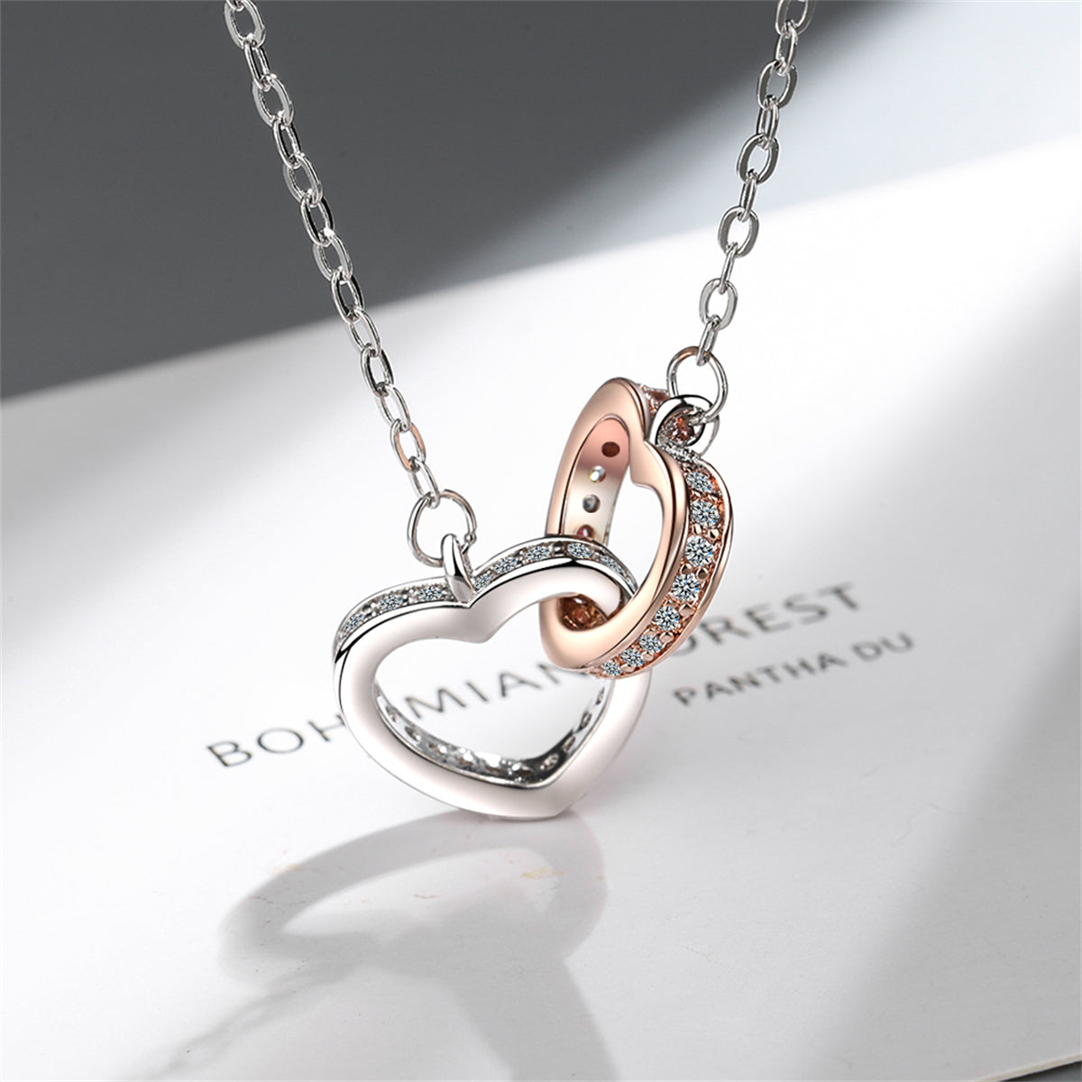 Cubic Zirconia and Two Tone Interlocked Heart Pendant Necklace, pendant necklace for women, botanical inspired, side view
