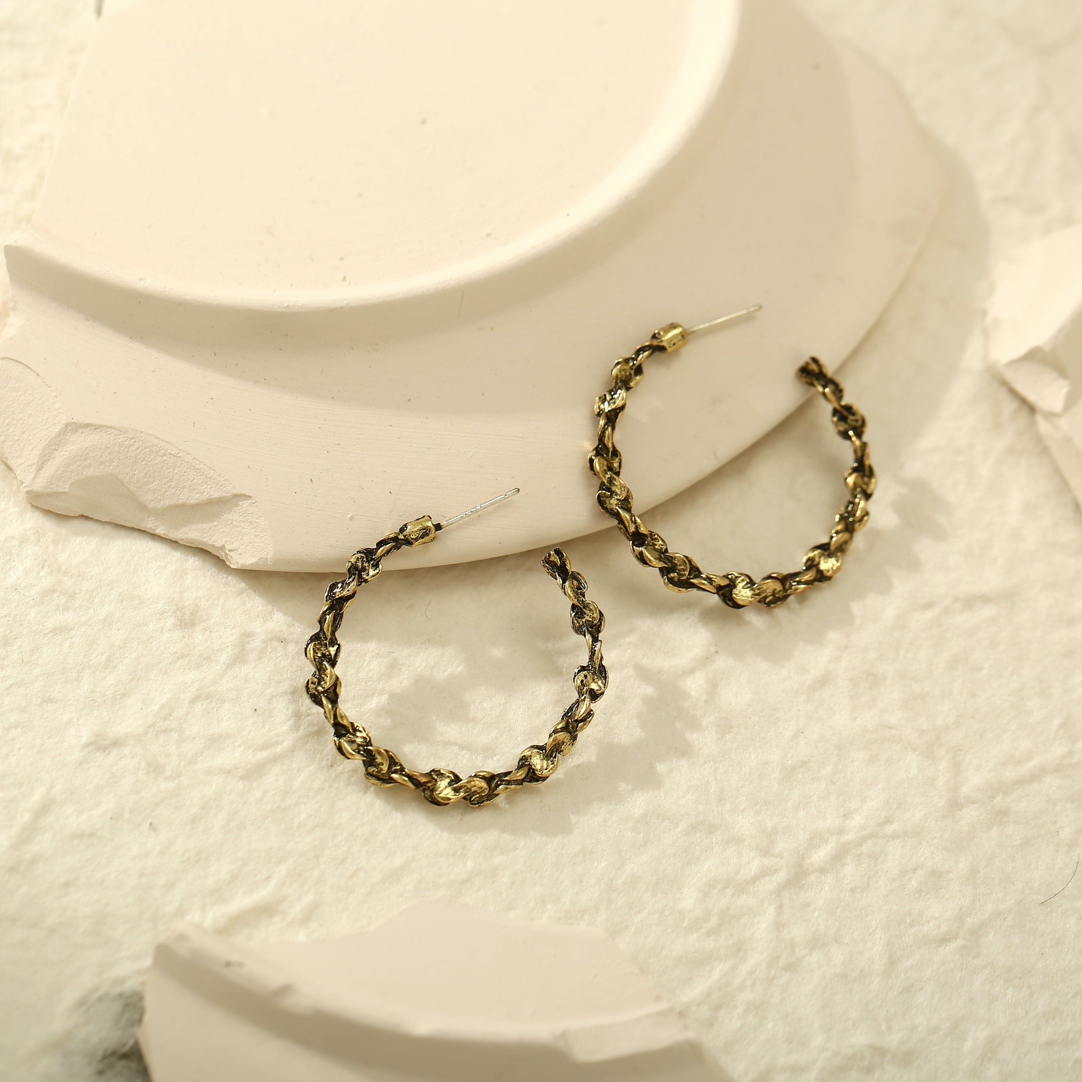 Beautifully crafted 18K gold-plated hoop earrings with a stylish chain, a must-have accessory for a fashionable look.