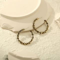 Beautifully crafted 18K gold-plated hoop earrings with a stylish chain, a must-have accessory for a fashionable look.