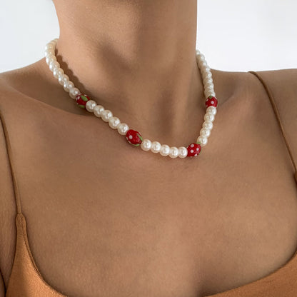 Red Acrylic and Pearl Strawberry Beaded Choker Necklace, pendant necklace for women, dainty minimalist design, lifestyle look