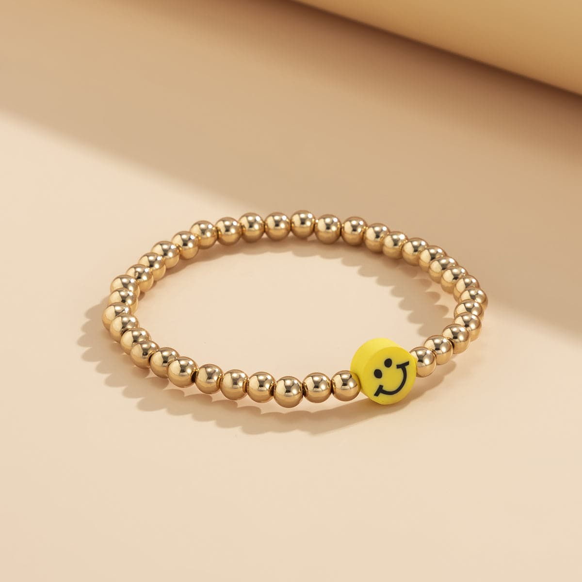 Acrylic and 18K Gold-Plated Smiley Charm Stretch Bracelet, gold bracelet for women, vintage-inspired design, lifestyle look