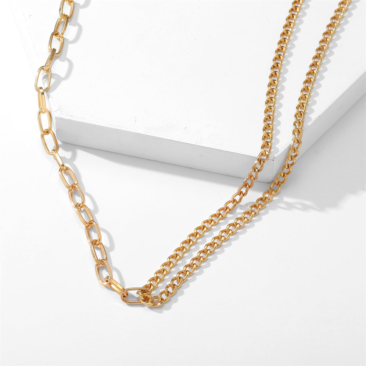 Chic 18K gold-plated contrast layered necklace showcasing a long chain with eye-catching links for a trendy appeal.
