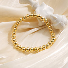 Elegant 18K gold-plated bead stretch bracelet featuring a single strand of shimmering gold beads.