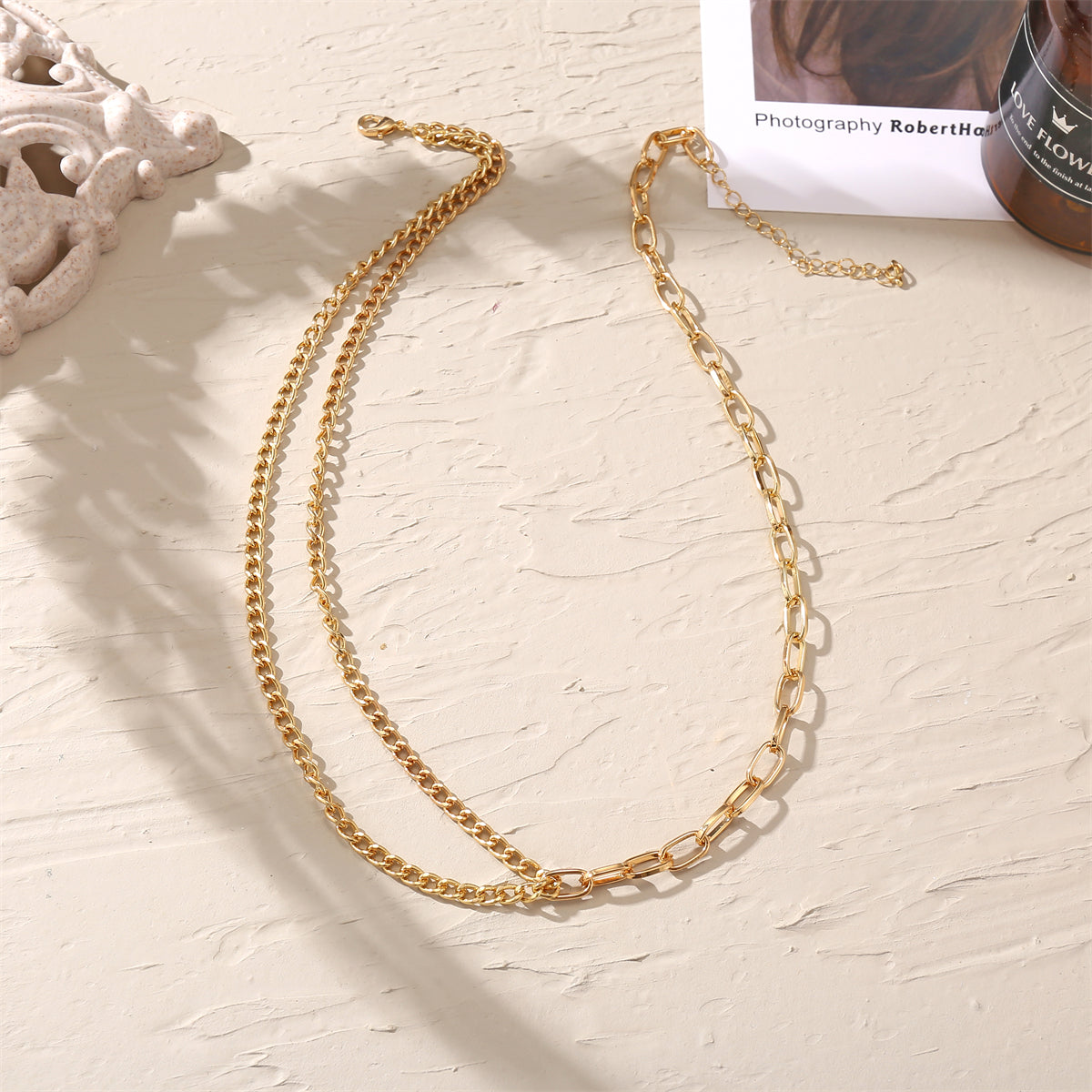 Beautiful 18K gold-plated layered necklace featuring a long chain with links, perfect for a sophisticated touch.