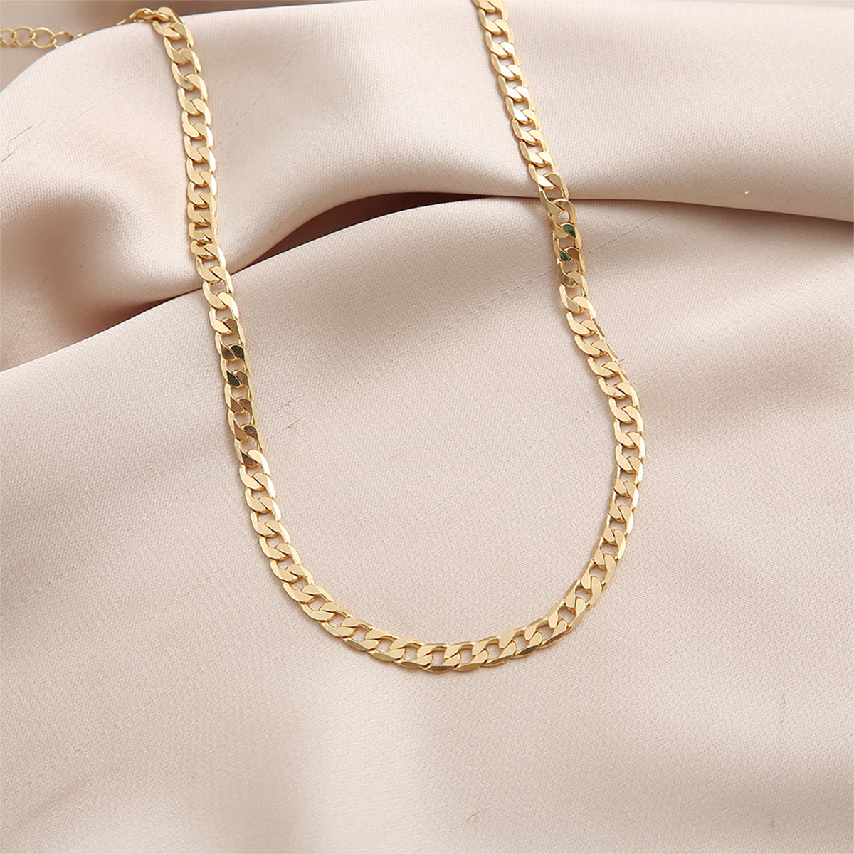 Beautifully crafted 18K gold-plated curb chain necklace showcasing small links, ideal for elevating your style effortlessly.