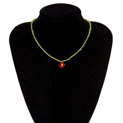 Green Acrylic and Howlite Beaded Flower Necklace, pendant necklace for women, vintage-inspired design, lifestyle look