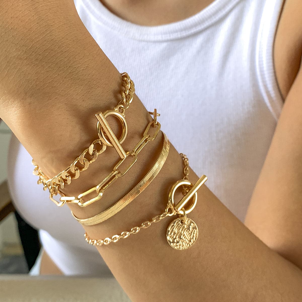 A stunning set of three adjustable 18K gold-plated bracelets with a chic chain and clasp design for versatile wear.