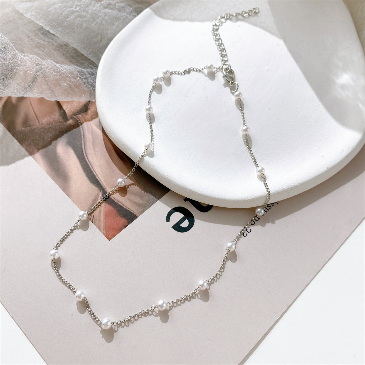 Pearl and Silver-Plated Station Chain Necklace, silver pendant necklace for women, botanical inspired, front view