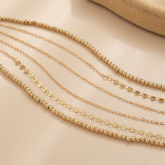 Stylish three-strand gold chain from an 18K gold-plated beaded waist chain set, perfect for any outfit.