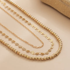 Exquisite three-strand gold chain, part of an 18K gold-plated beaded waist chain set, ideal for elegant styling.
