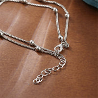 Silvertone Dolphin Layered Charm Anklet