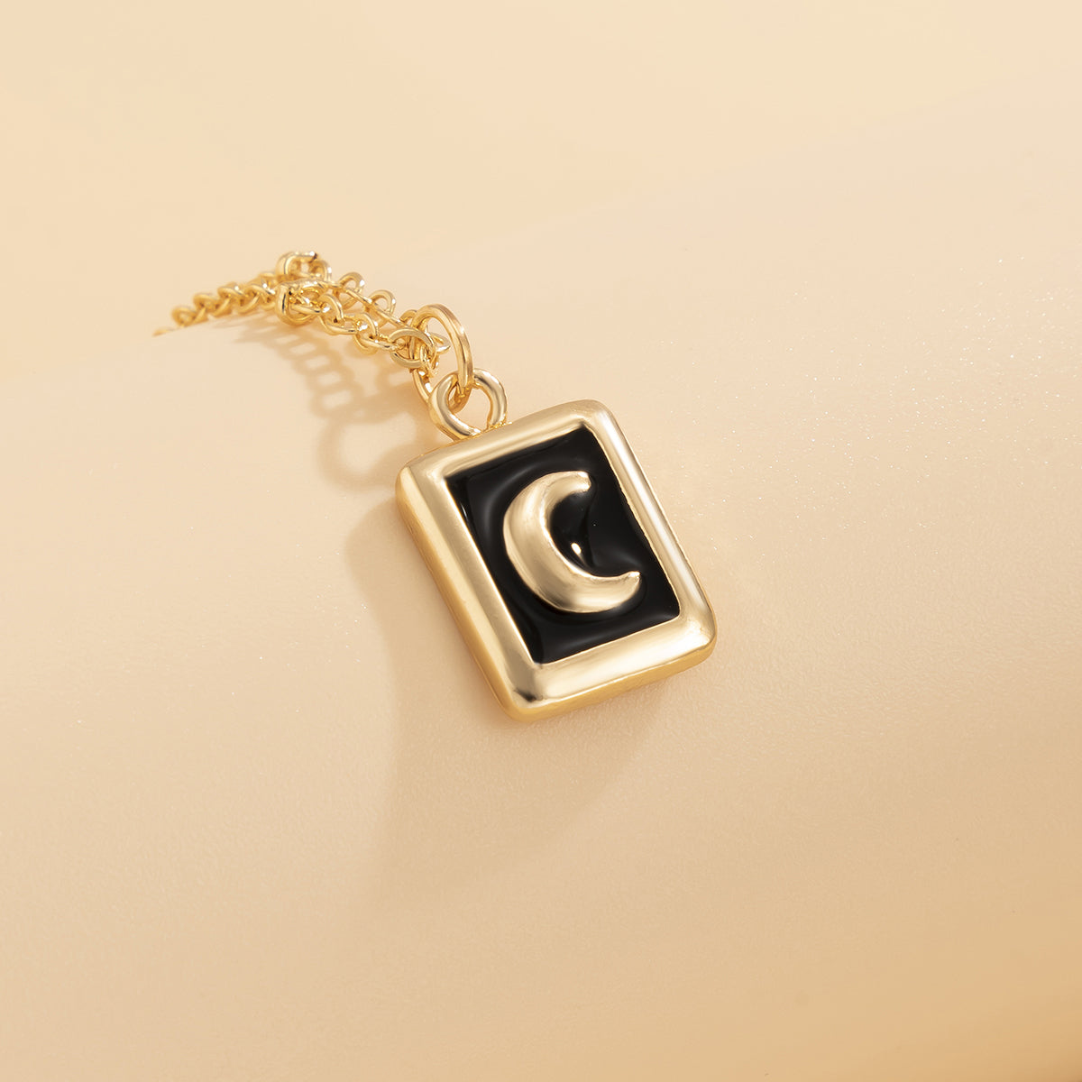 Black Enamel and 18K Gold-Plated Moon Card Pendant Necklace, gold pendant necklace for women, everyday style, detail close-up