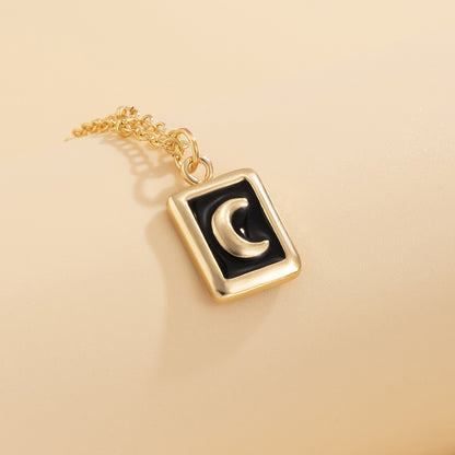 Black Enamel and 18K Gold-Plated Moon Card Pendant Necklace, gold pendant necklace for women, everyday style, detail close-up