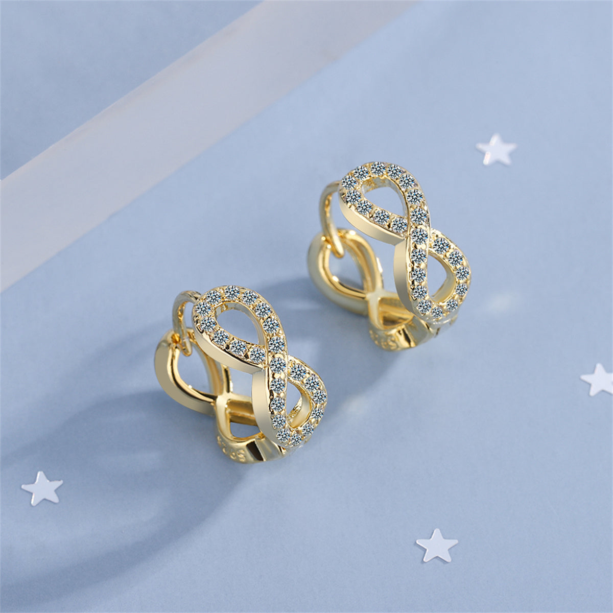 Cubic Zirconia and 18K Gold-Plated Infinity Huggie Earrings, gold huggie earrings, dainty minimalist design, side view