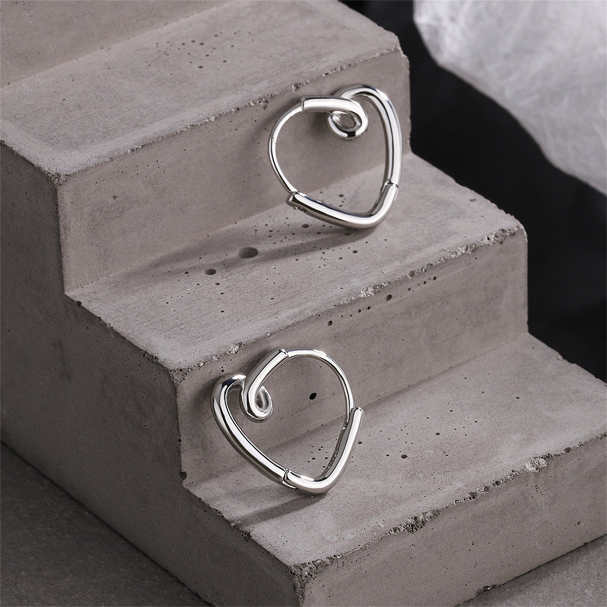 Silver-Plated Heart Huggie Earrings, silver huggie earrings, vintage-inspired design, lifestyle look