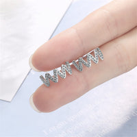Cubic Zirconia & Silvertone Wave Stud Earrings