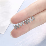Cubic Zirconia & Silvertone Wave Stud Earrings