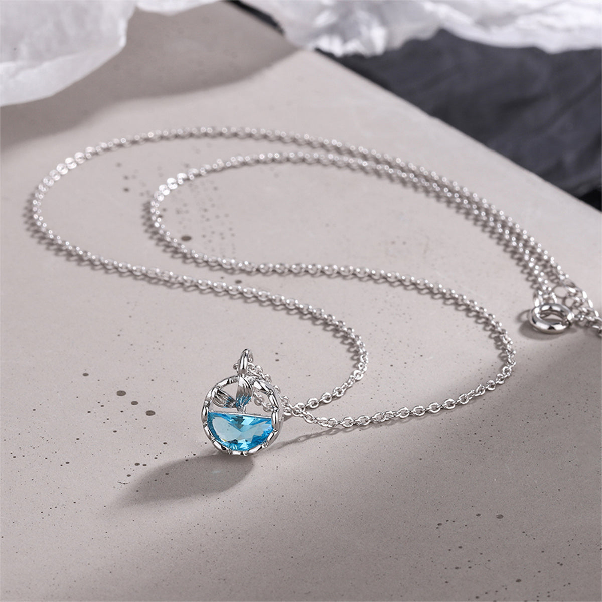 Blue Crystal and Silver-Plated Circular Fishtail Pendant Necklace, silver pendant necklace for women, detail close-up