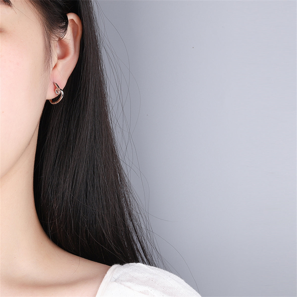 Silver-Plated Heart Huggie Earrings, silver huggie earrings, vintage-inspired design, styled look