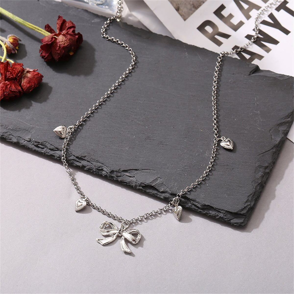 Silver-Plated Bow Heart Station Necklace, silver pendant necklace for women, elegant gift for her, detail close-up