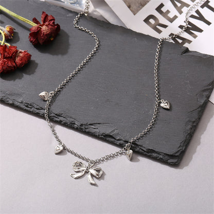 Silver-Plated Bow Heart Station Necklace, silver pendant necklace for women, elegant gift for her, detail close-up